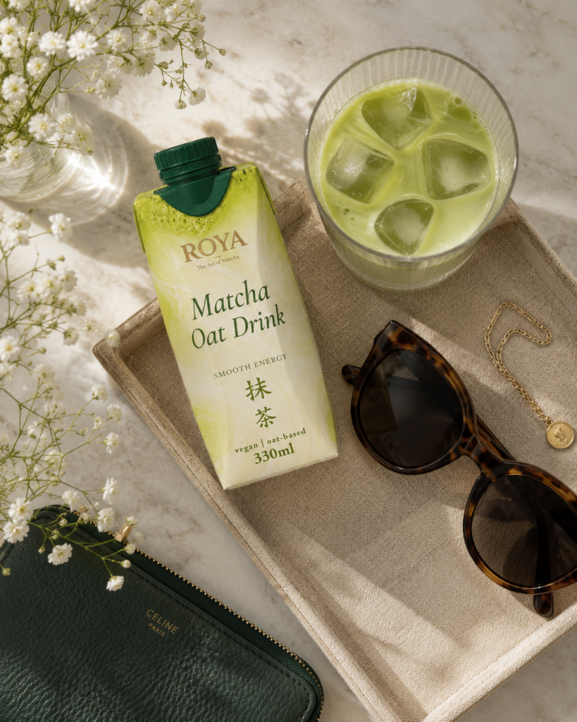 ROYA carton on a tray with a glass of iced matcha